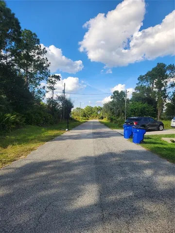 a view of road with ocean view