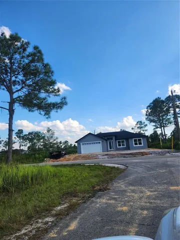 a view of a yard in front of the house