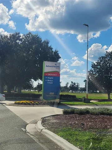 a sign board with a big yard
