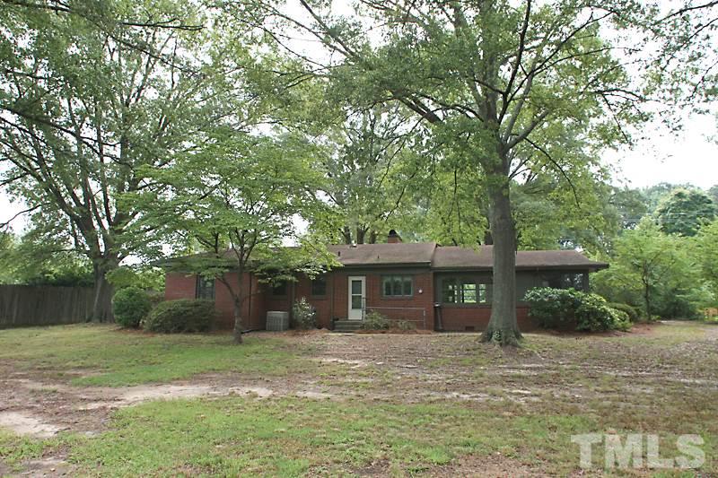 313 Loop Road Garner, NC 27529 - Photo 12 of 12 a front view of a house with a garden
