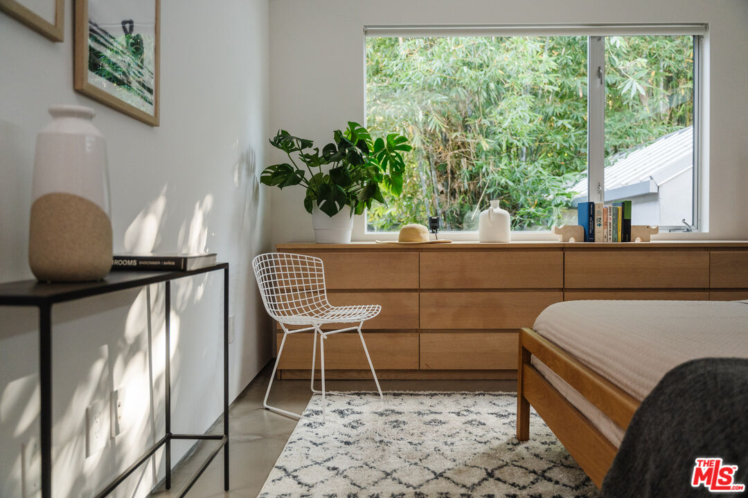 8570 Rugby Drive West Hollywood, CA 90069 - Photo 11 of 35 a living room with a couch and a potted plant
