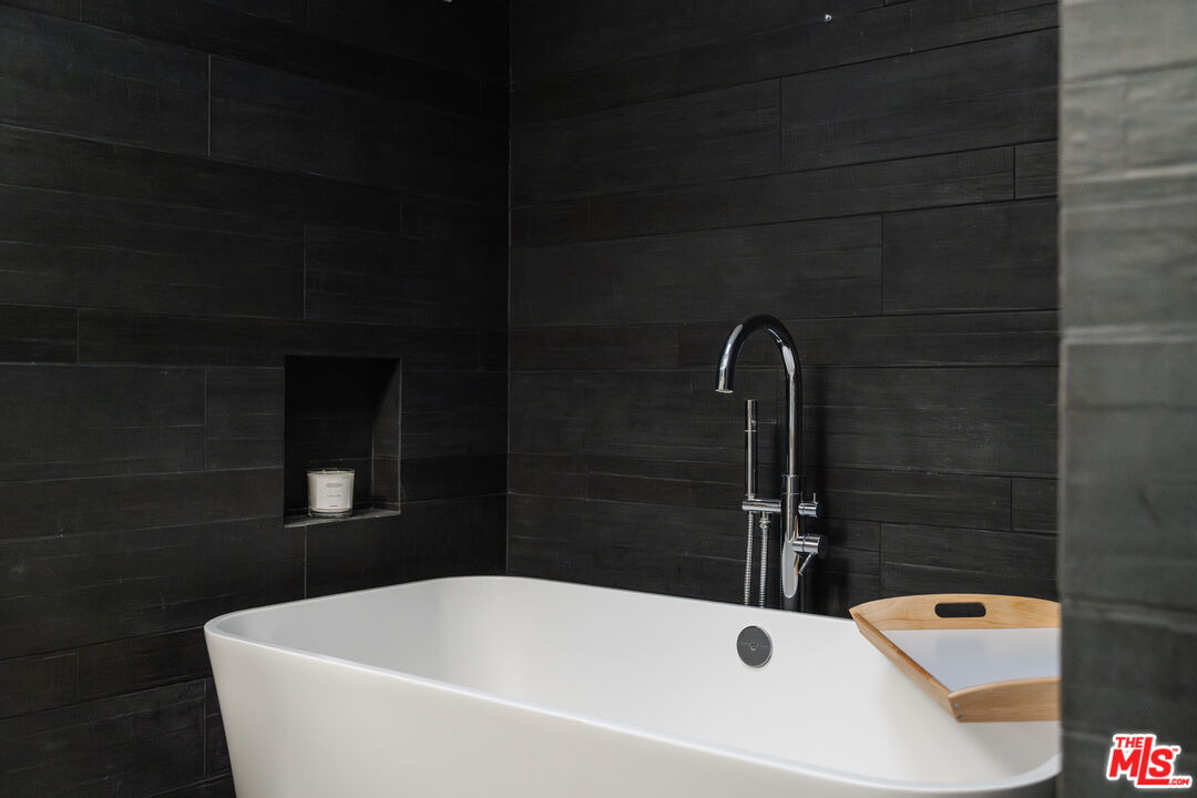 8570 Rugby Drive West Hollywood, CA 90069 - Photo 15 of 35 a white bath tub sitting in a bathroom