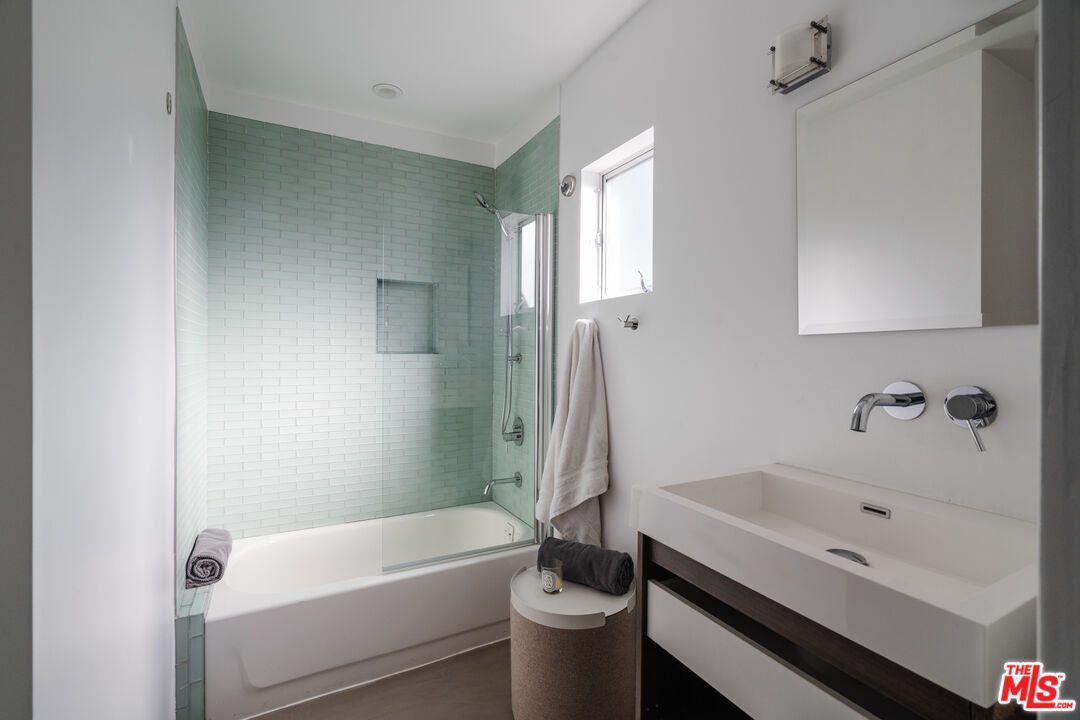 8570 Rugby Drive West Hollywood, CA 90069 - Photo 17 of 35 a bathroom with a sink a toilet and bathtub