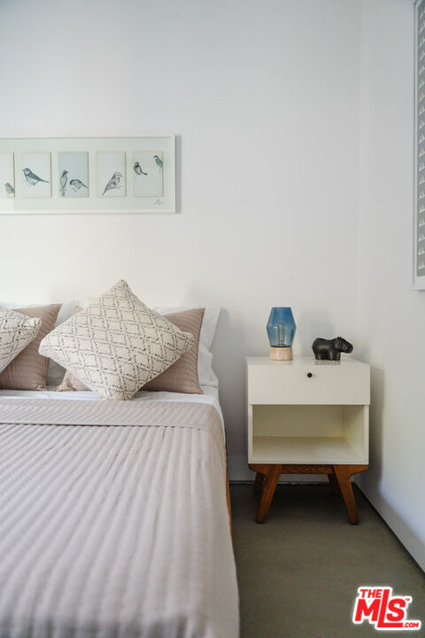 8570 Rugby Drive West Hollywood, CA 90069 - Photo 22 of 35 a bedroom with a bed and a table