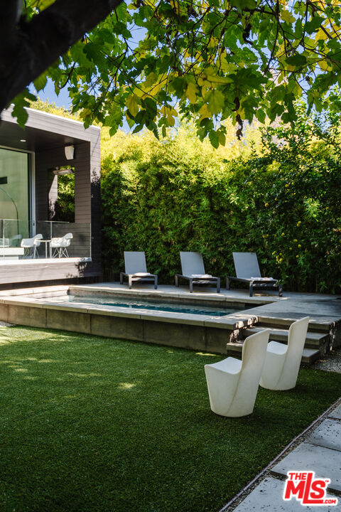 8570 Rugby Drive West Hollywood, CA 90069 - Photo 26 of 35 a house view with a sitting space garden view