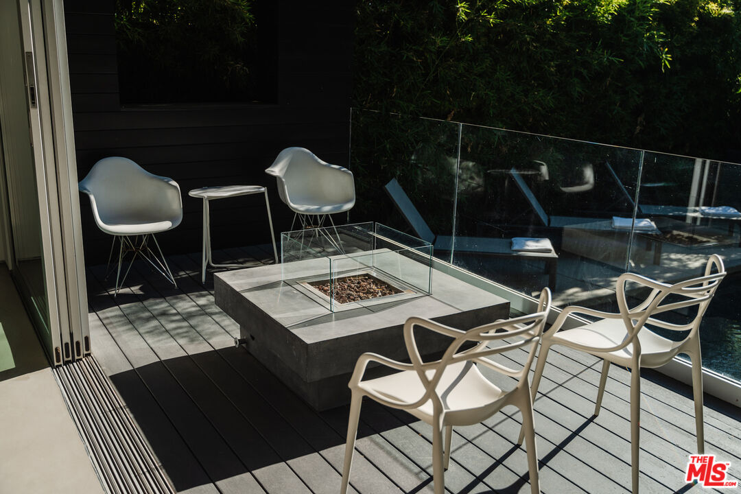 8570 Rugby Drive West Hollywood, CA 90069 - Photo 27 of 35 a table and chairs sitting in a roof deck