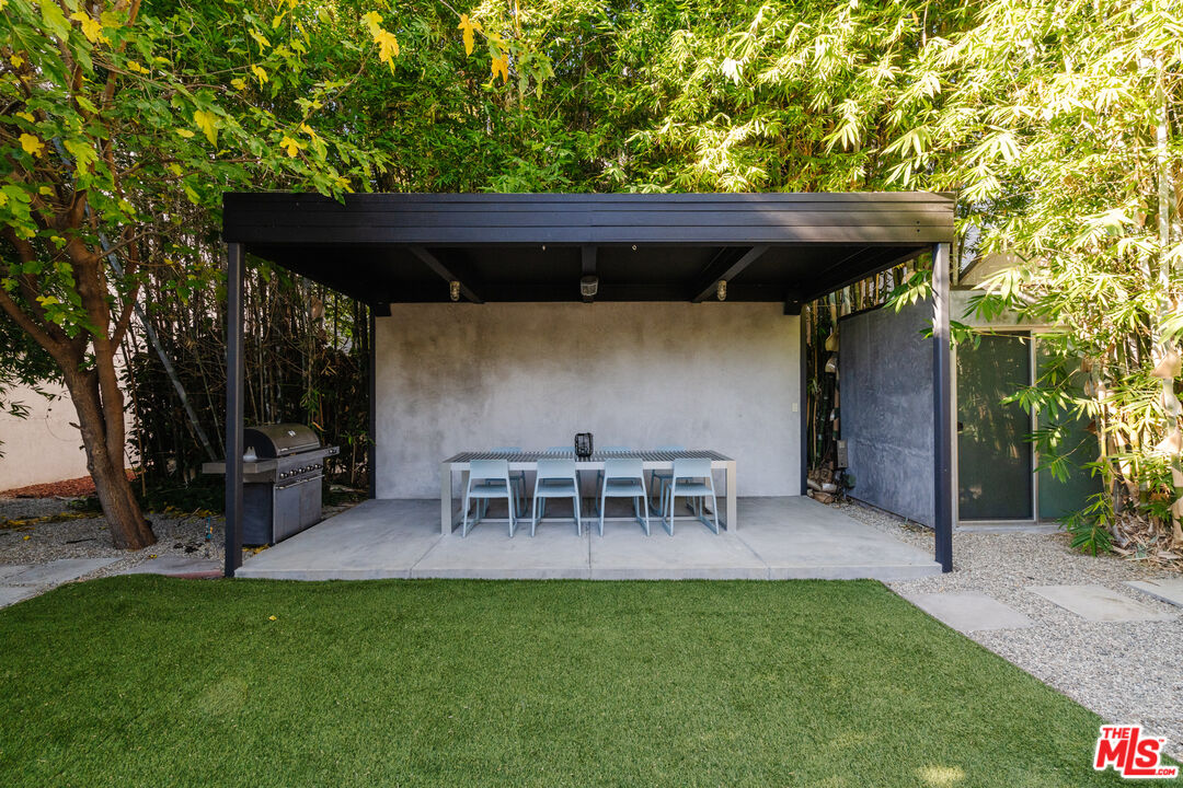 8570 Rugby Drive West Hollywood, CA 90069 - Photo 29 of 35 a view of a chairs and table in the patio in front of a house