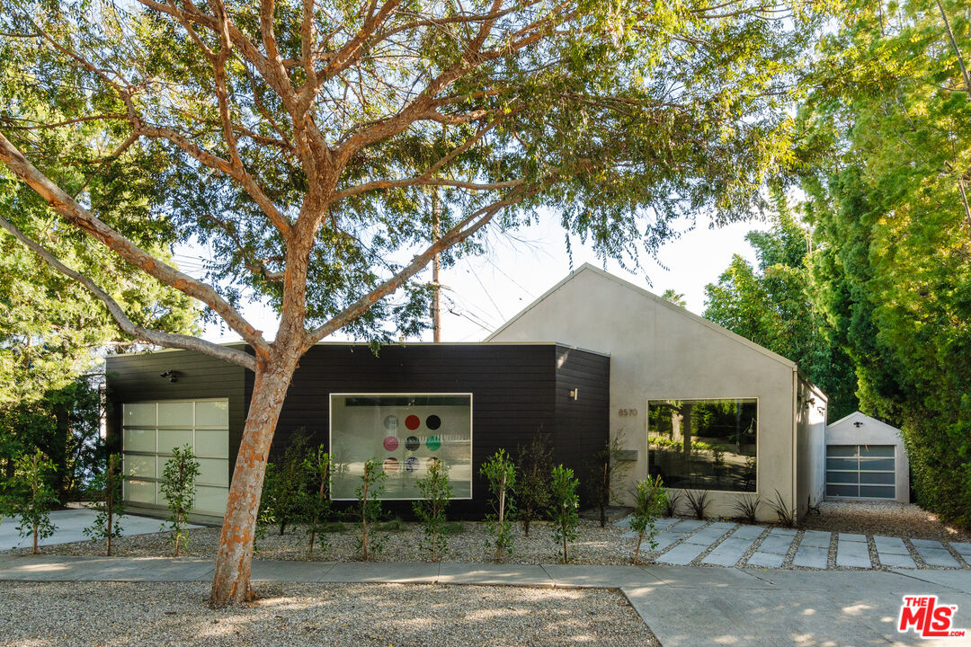 8570 Rugby Drive West Hollywood, CA 90069 - Photo 3 of 35 a front view of a house with garden