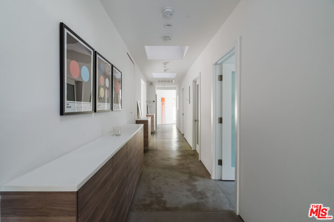 8570 Rugby Drive West Hollywood, CA 90069 - Photo 4 of 35 a view of a hallway with wooden floor and staircase