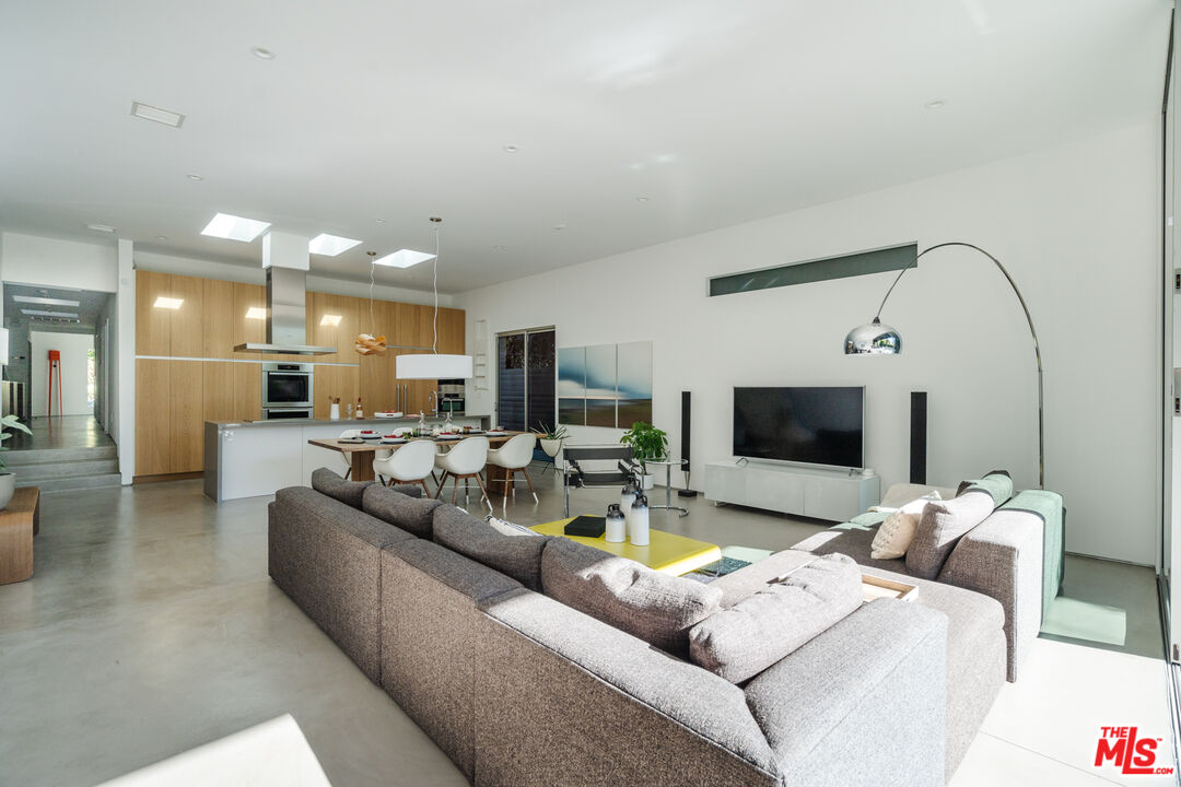 8570 Rugby Drive West Hollywood, CA 90069 - Photo 9 of 35 a living room with furniture and a flat screen tv