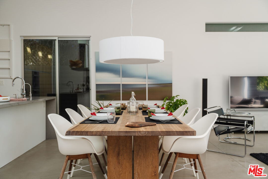 8570 Rugby Drive West Hollywood, CA 90069 - Photo 10 of 35 a view of a dining room with furniture window and outside view