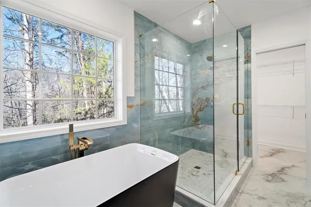 a bathroom with a bathtub and a sink