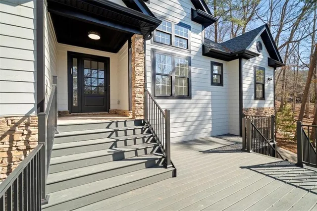 a view of a house with a door and wooden floor