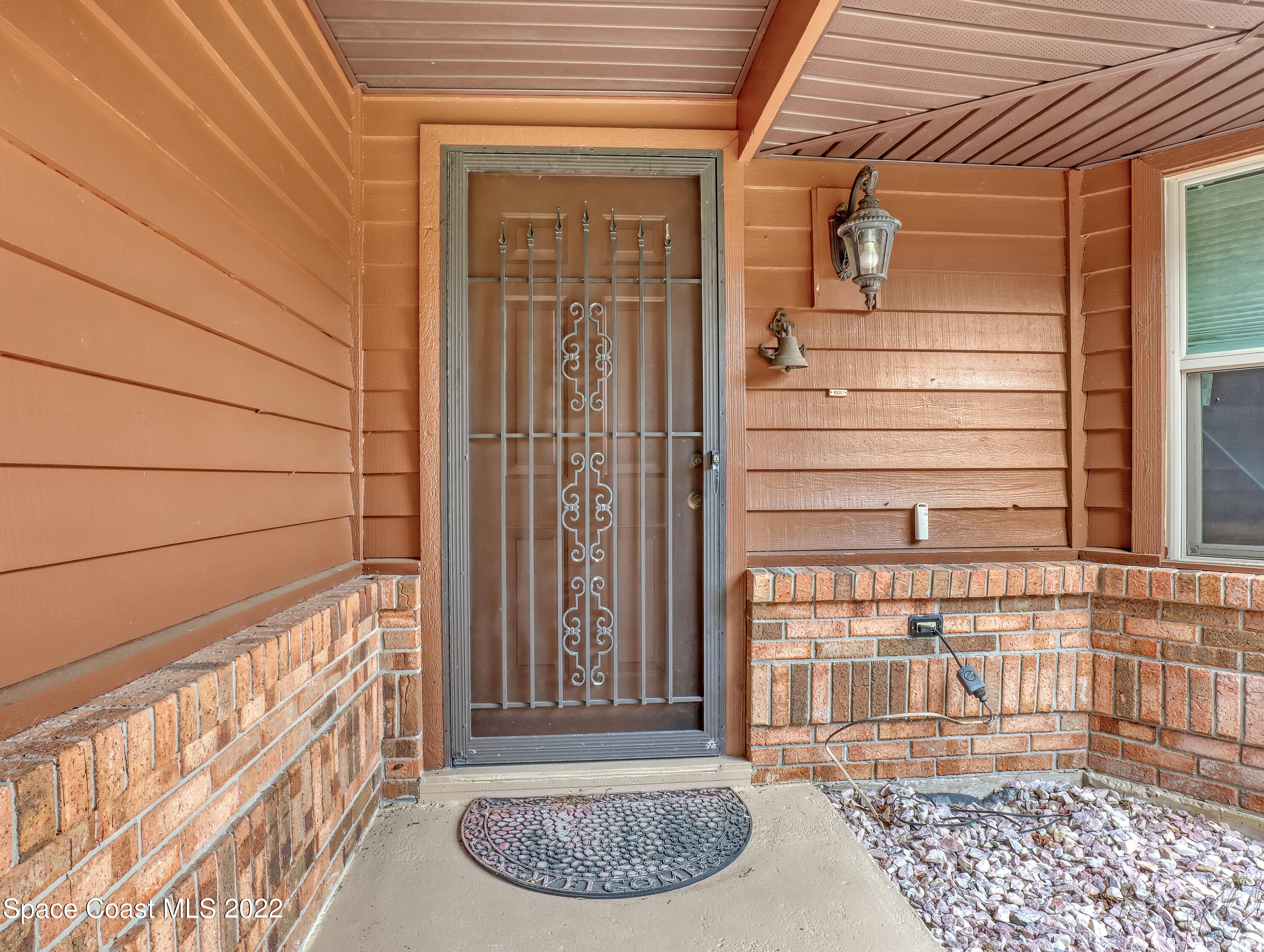 409 Rheine Road Northwest Palm Bay, FL 32907 - Photo 5 of 33 a view of a door and a window