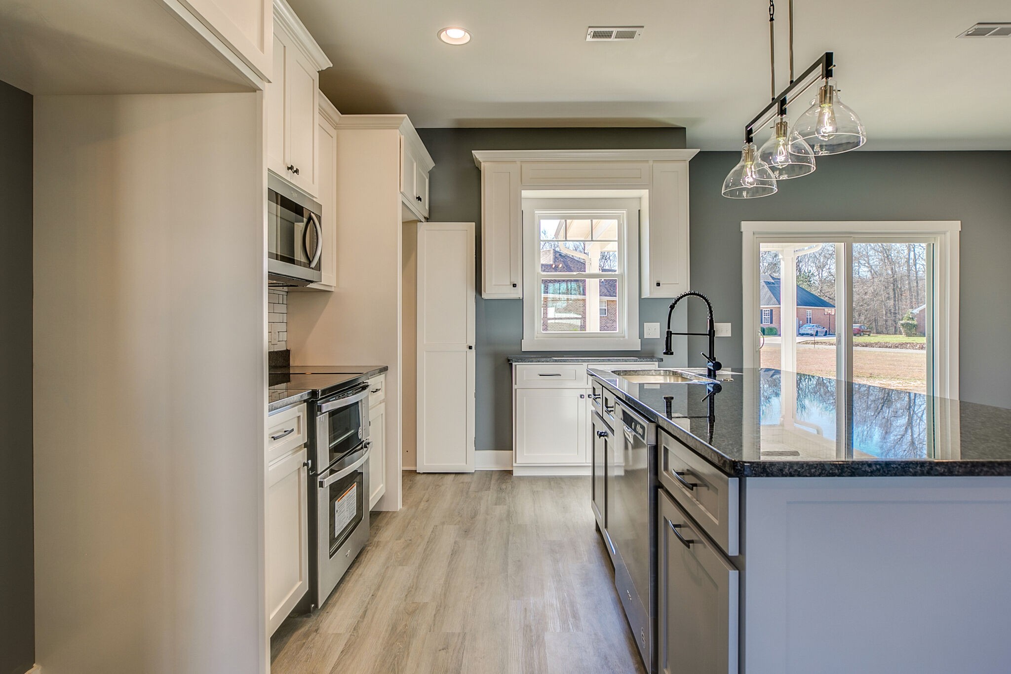 42 Post Road Manchester, TN 37355 - Photo 14 of 43 a kitchen with stainless steel appliances granite countertop a refrigerator a stove top oven a sink and dishwasher