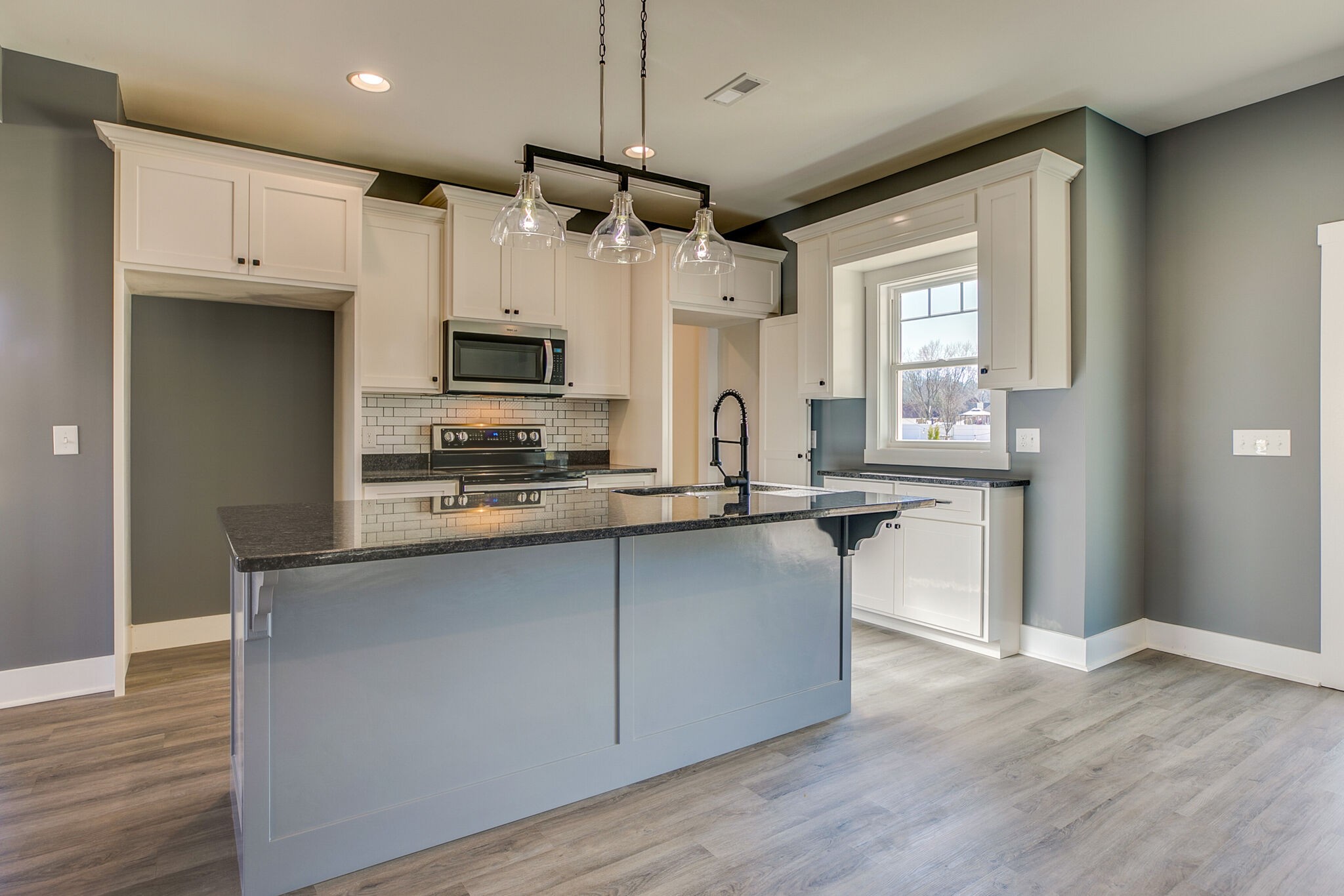42 Post Road Manchester, TN 37355 - Photo 15 of 43 a kitchen with stainless steel appliances granite countertop a refrigerator a sink and a stove