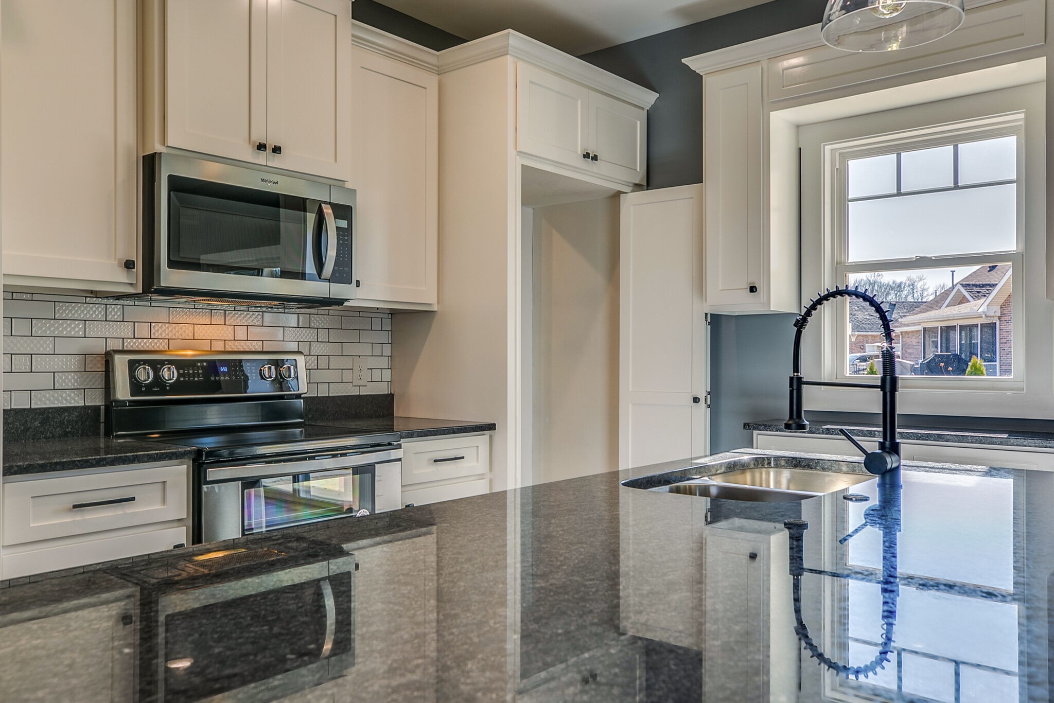 42 Post Road Manchester, TN 37355 - Photo 18 of 43 a kitchen with stainless steel appliances a stove microwave and sink