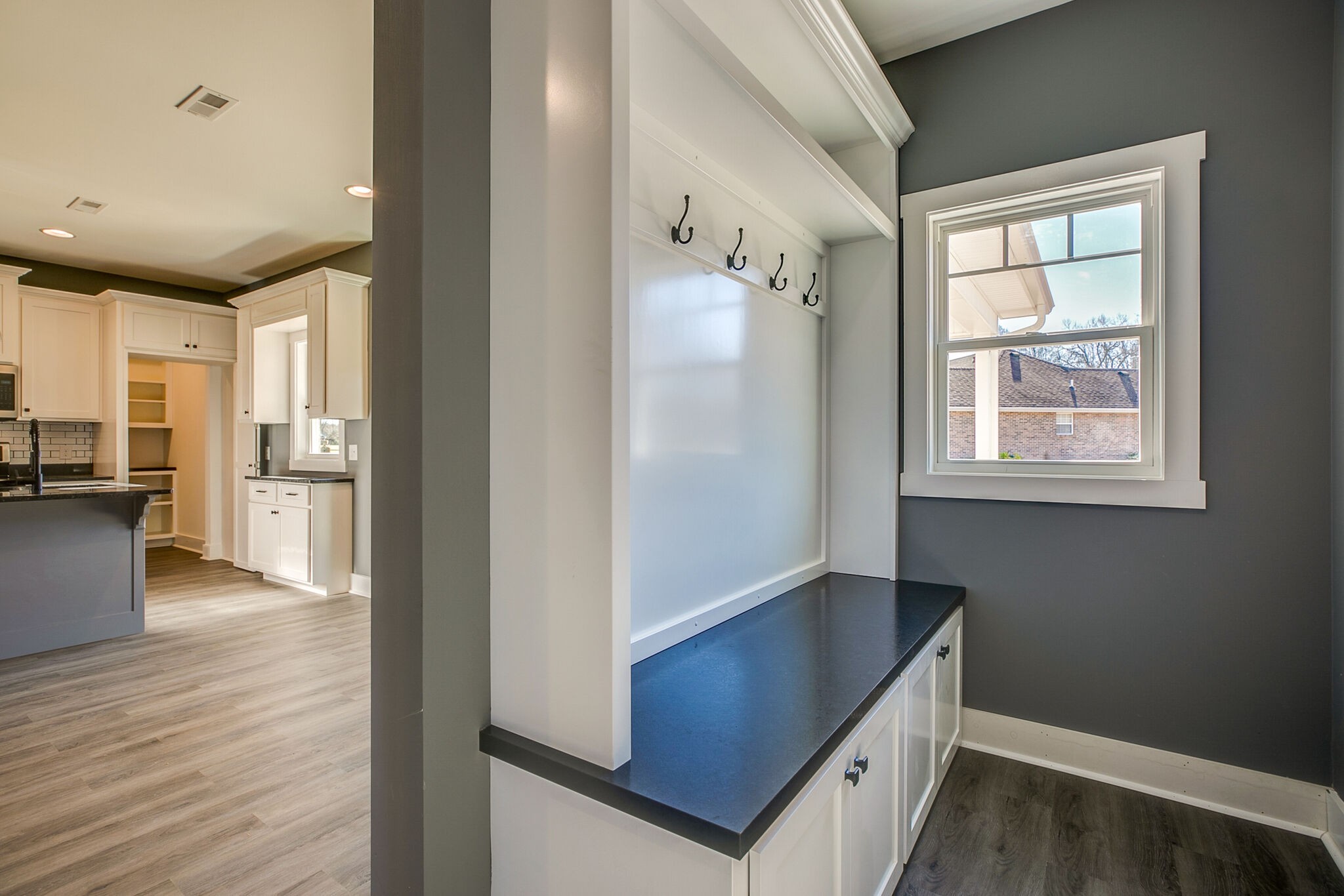 42 Post Road Manchester, TN 37355 - Photo 22 of 43 a view of a hallway with wooden floor and a bathroom