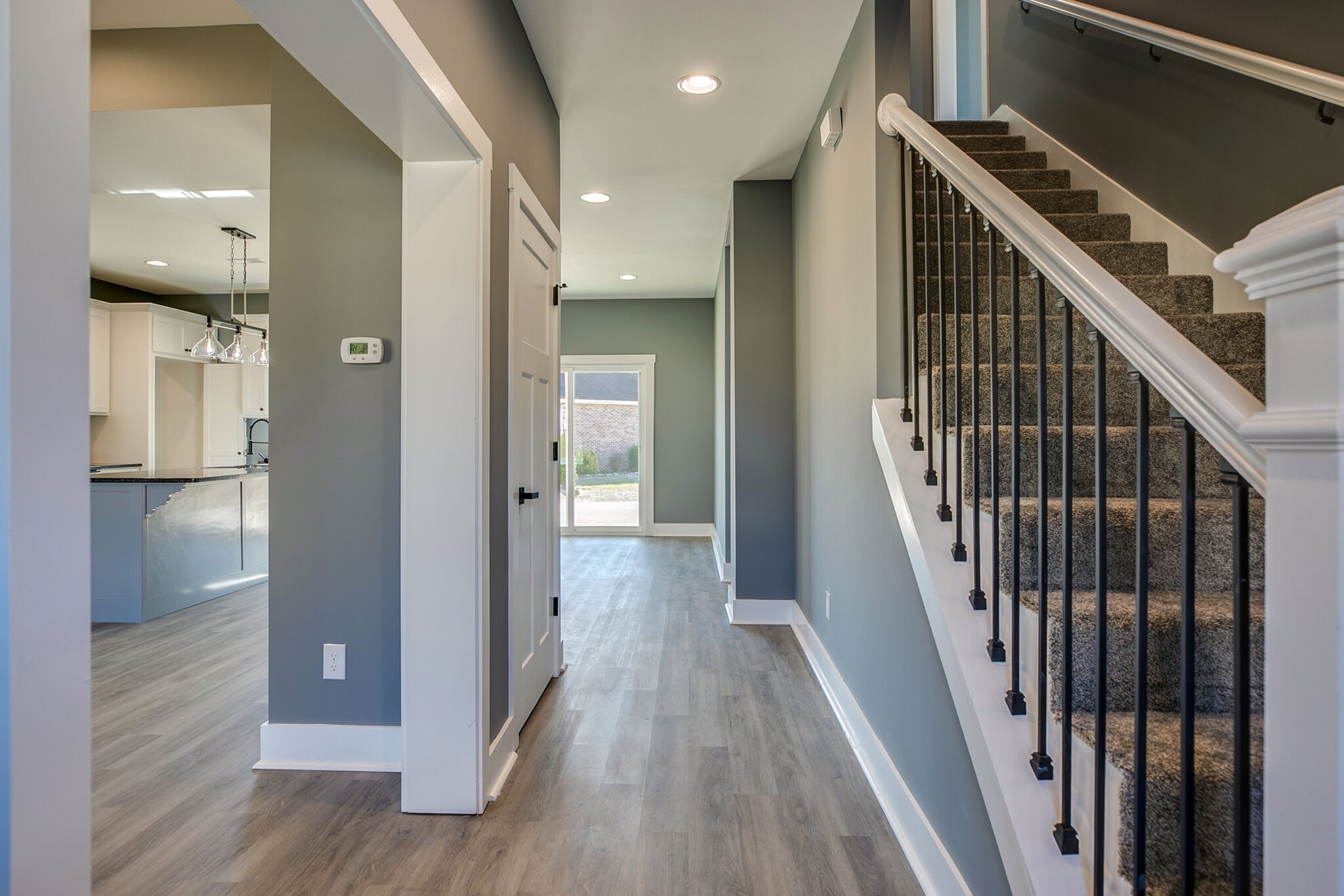 42 Post Road Manchester, TN 37355 - Photo 4 of 43 a view of a hallway with wooden floor and staircase