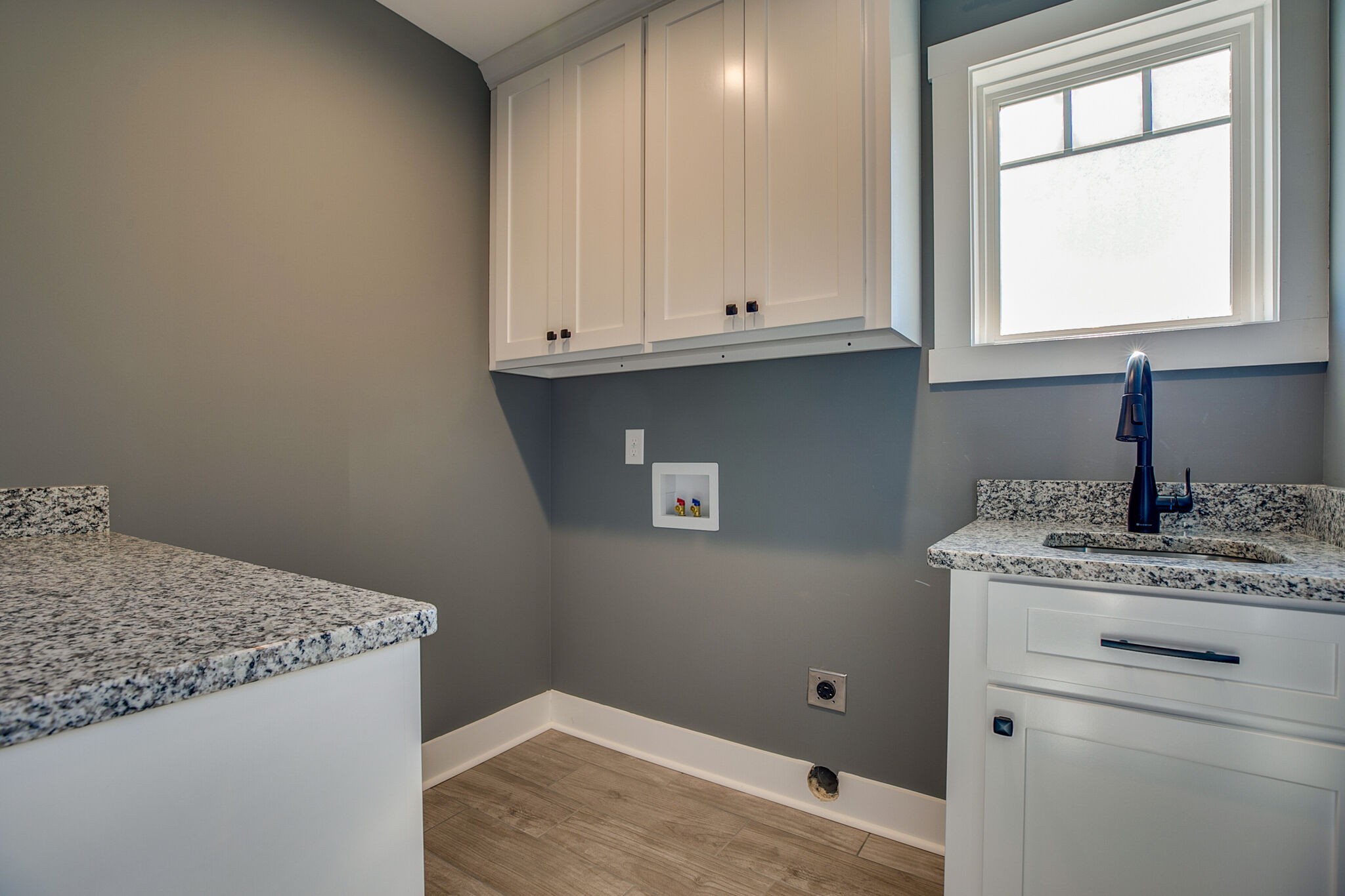 42 Post Road Manchester, TN 37355 - Photo 32 of 43 a room with a granite countertop white cabinets and a sink
