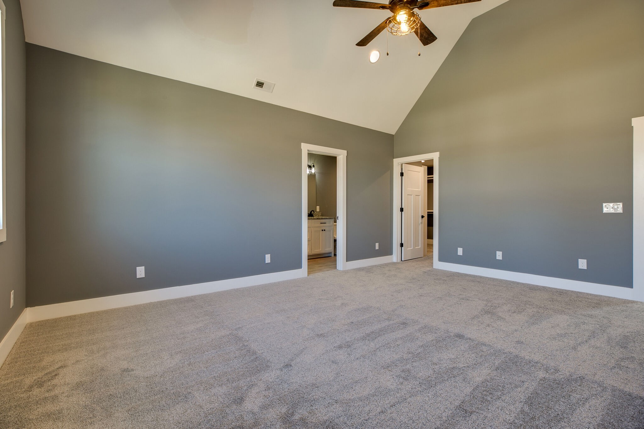 42 Post Road Manchester, TN 37355 - Photo 34 of 43 an empty room with a ceiling fan and carpet