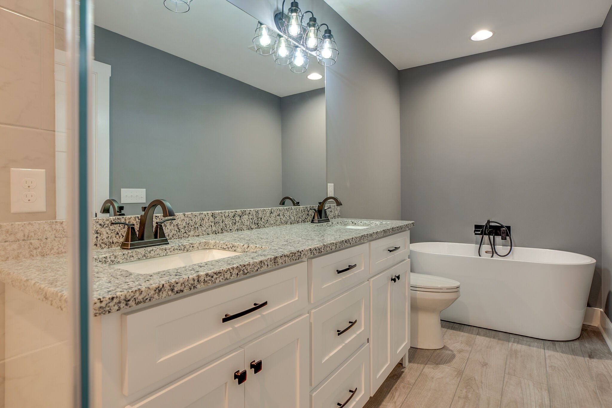 42 Post Road Manchester, TN 37355 - Photo 36 of 43 a bathroom with a granite countertop sink and a mirror