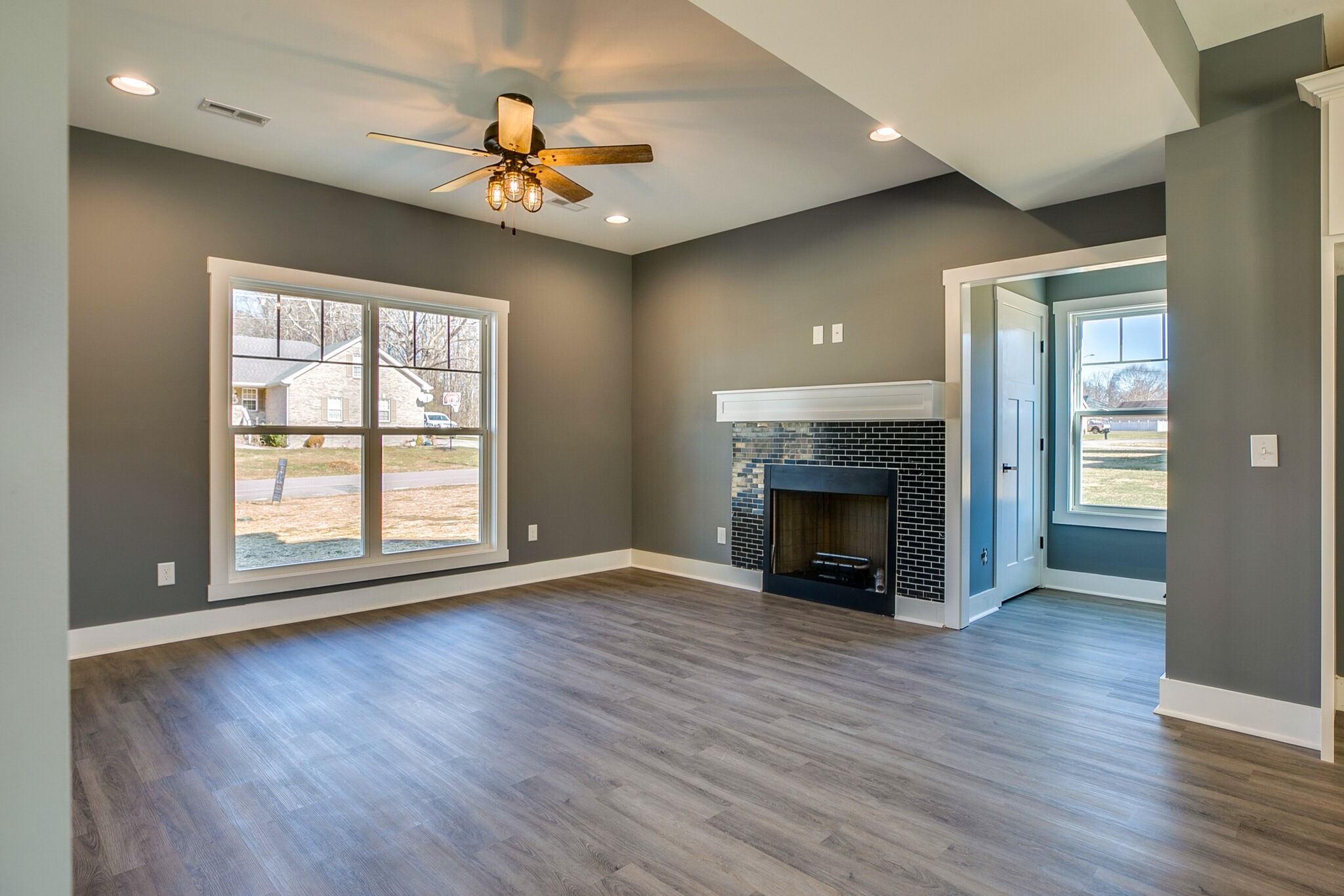 42 Post Road Manchester, TN 37355 - Photo 8 of 43 a view of an empty room with wooden floor fireplace and a window
