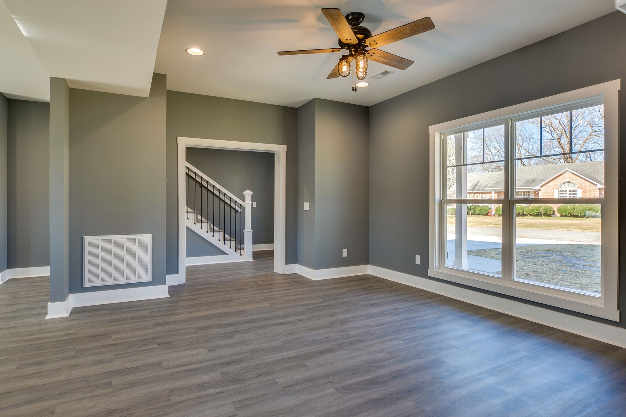 42 Post Road Manchester, TN 37355 - Photo 9 of 43 a view of an empty room with a window and wooden floor