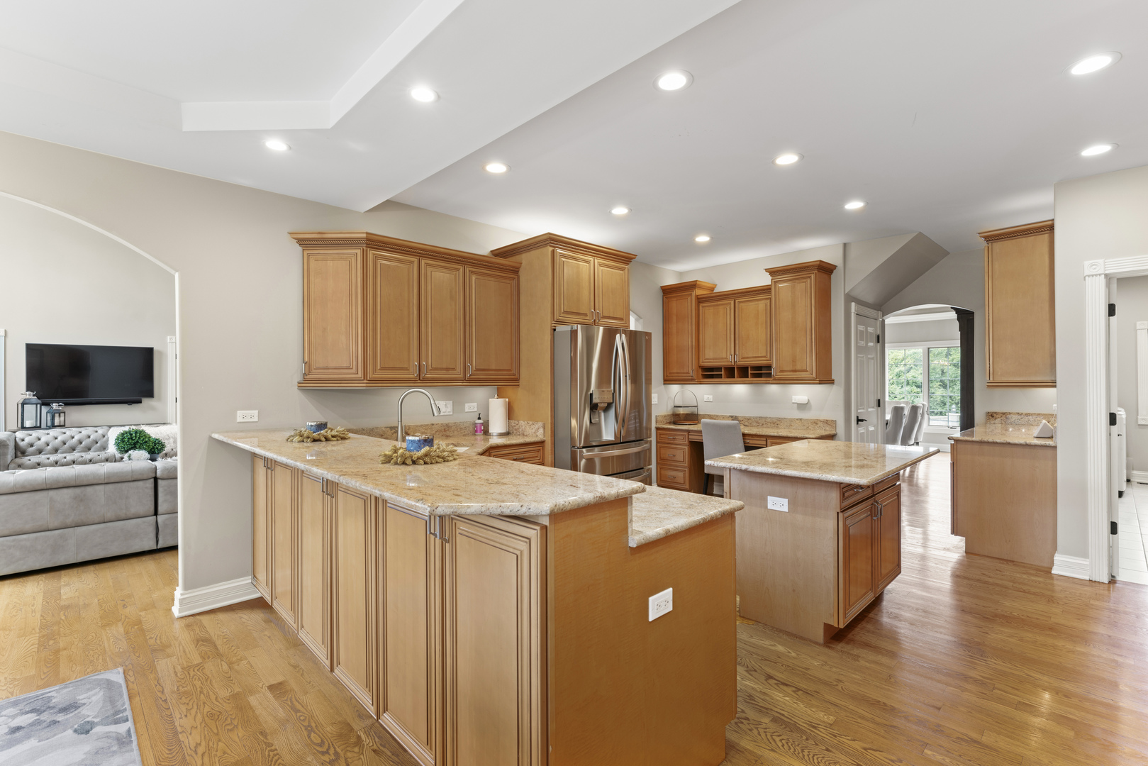 121 Florence Road Inverness, IL 60010 - Photo 15 of 54 a kitchen with stainless steel appliances kitchen island granite countertop a stove and a sink