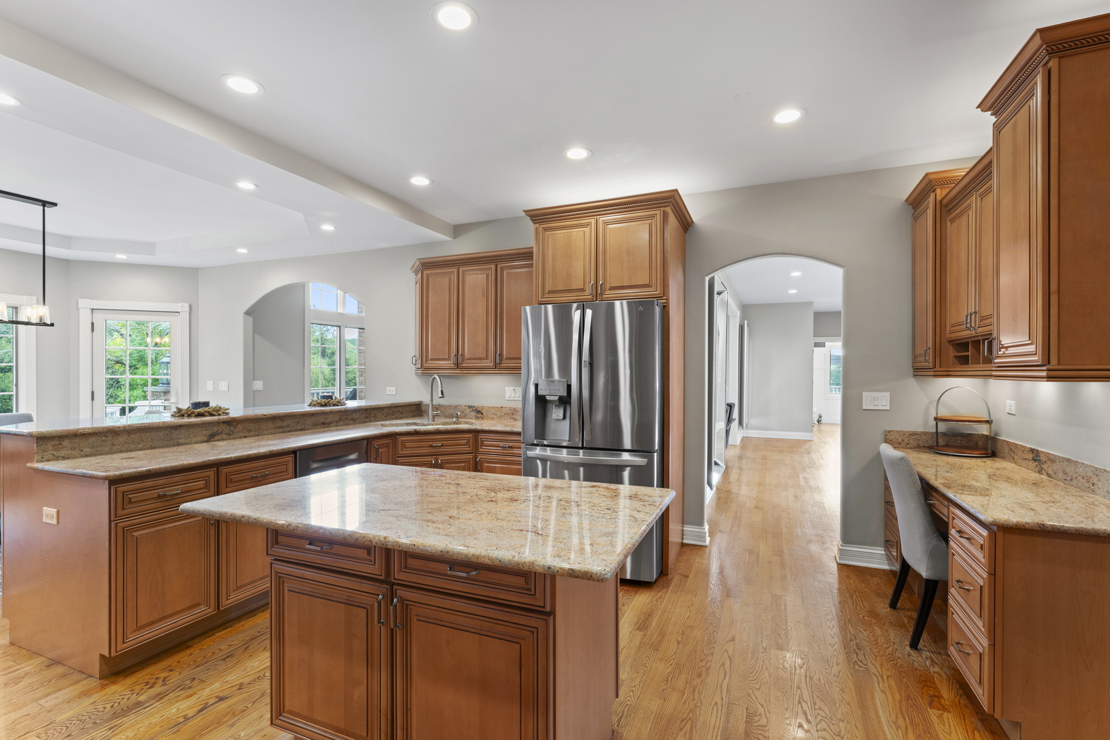 121 Florence Road Inverness, IL 60010 - Photo 16 of 54 a kitchen with stainless steel appliances granite countertop a sink a stove and a refrigerator
