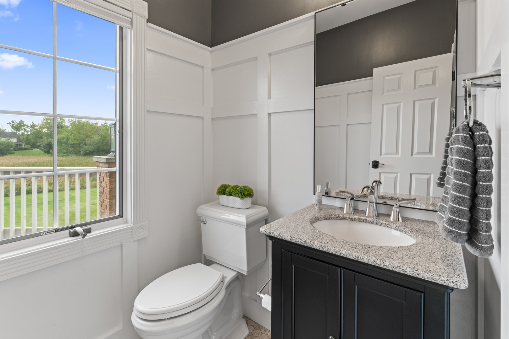 121 Florence Road Inverness, IL 60010 - Photo 17 of 54 a bathroom with a granite countertop sink toilet and large mirror