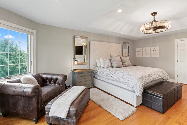 a view of walk in closet with clothes