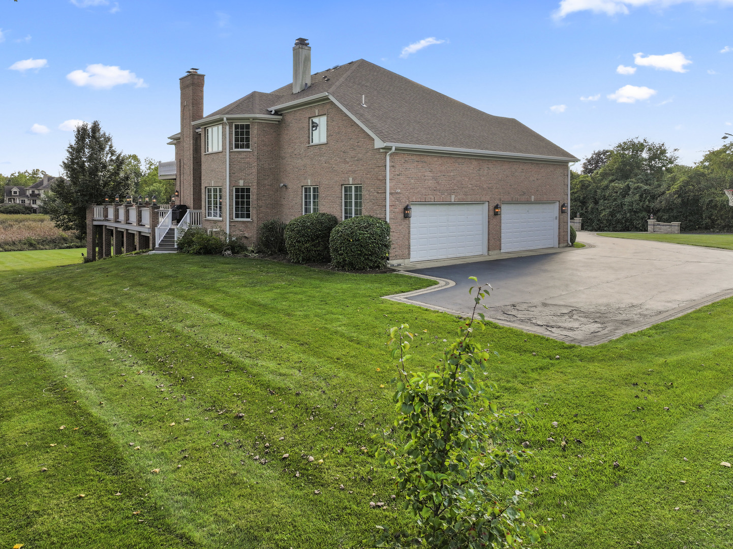 121 Florence Road Inverness, IL 60010 - Photo 4 of 54 a front view of a house with a yard and trees