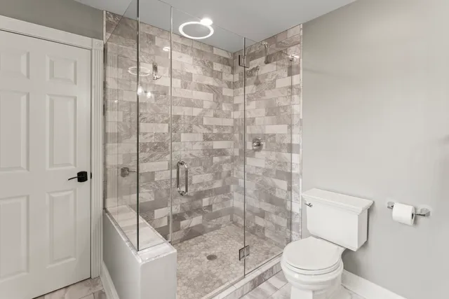 a bathroom with a double vanity sink and mirror