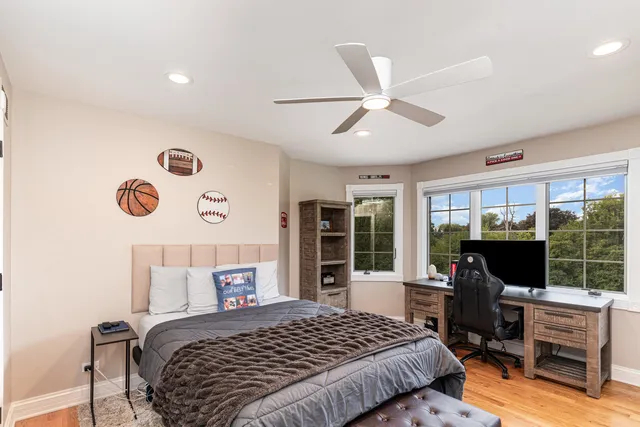 an aerial view of a house with a garden and trees