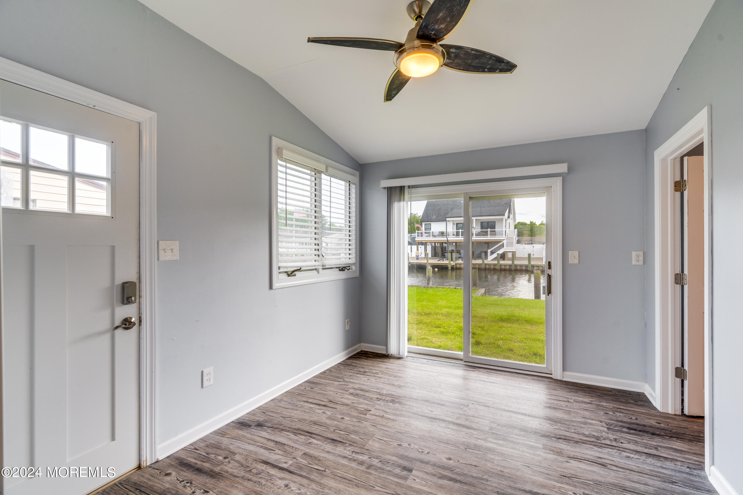 14 Bayview Drive Waretown, NJ 08758 - Photo 12 of 35 a view of an empty room with a window and wooden floor