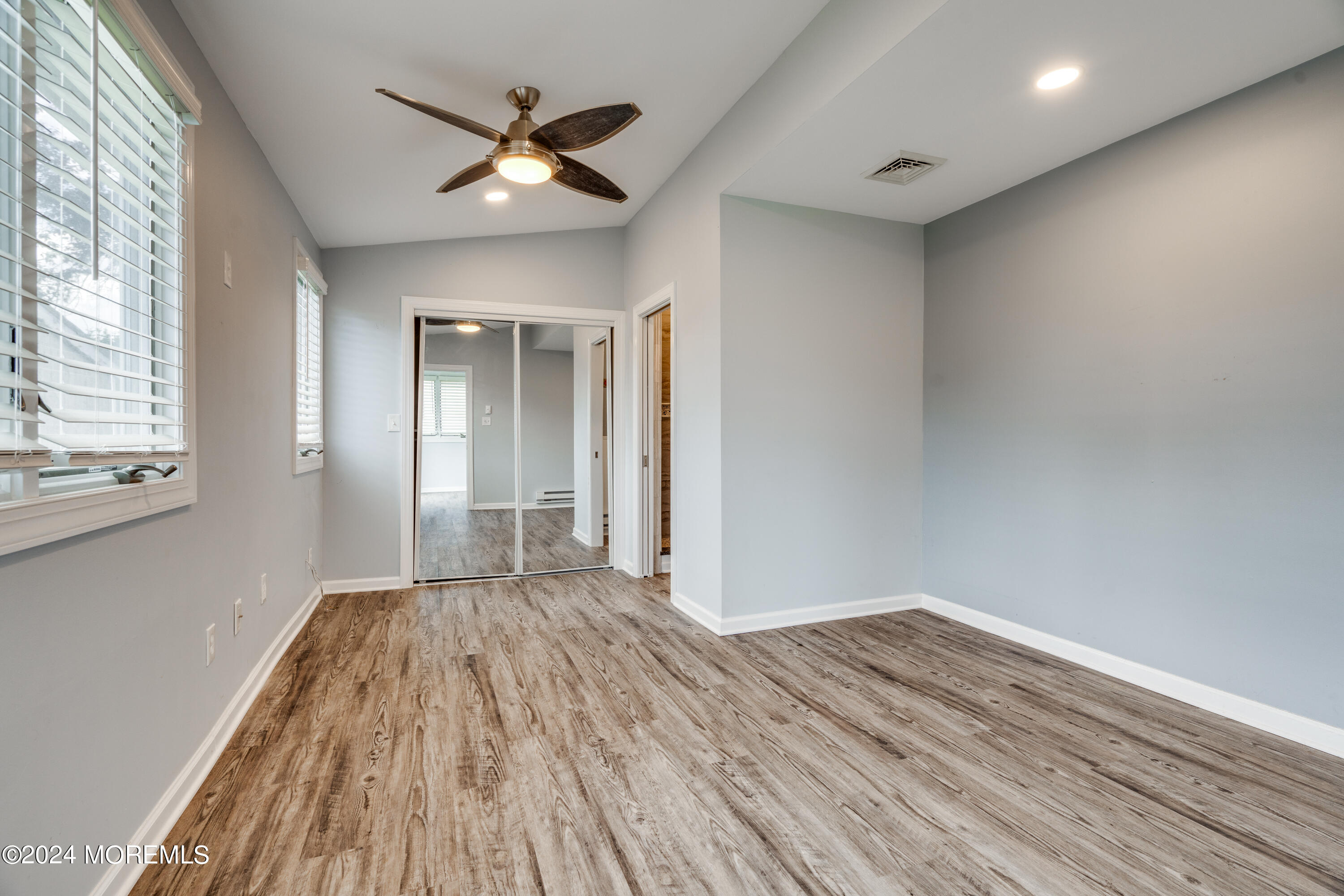 14 Bayview Drive Waretown, NJ 08758 - Photo 13 of 35 wooden floor in an empty room with a window