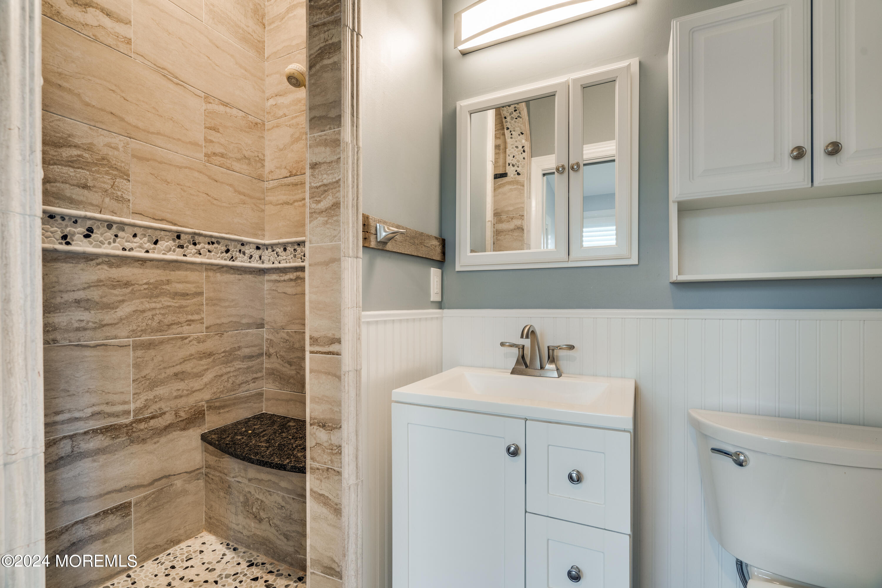 14 Bayview Drive Waretown, NJ 08758 - Photo 16 of 35 a bathroom with a sink and a mirror
