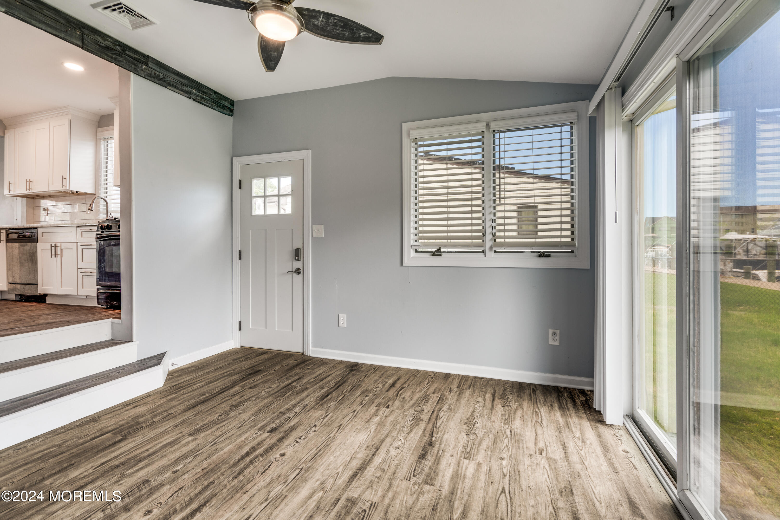 14 Bayview Drive Waretown, NJ 08758 - Photo 17 of 35 a view of an empty room with wooden floor and a window