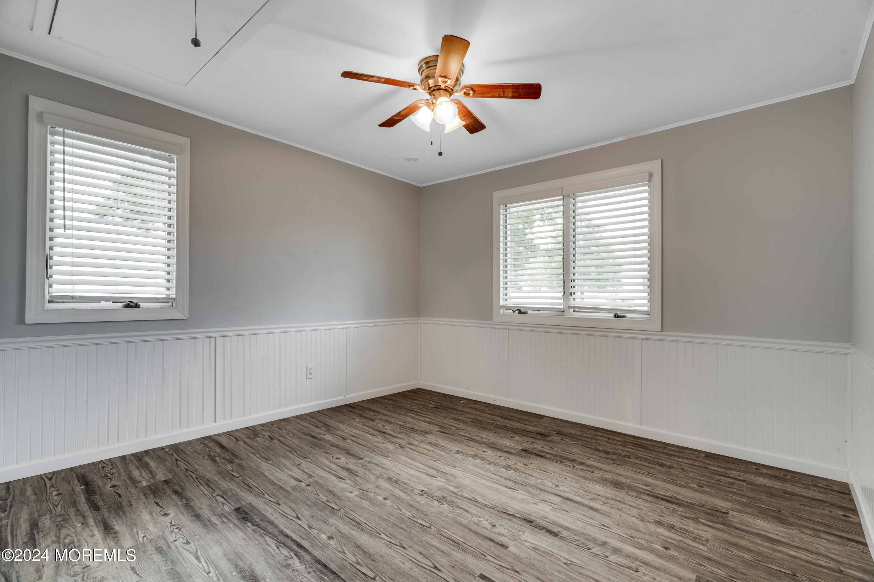 14 Bayview Drive Waretown, NJ 08758 - Photo 18 of 35 a view of empty room with wooden floor and fan