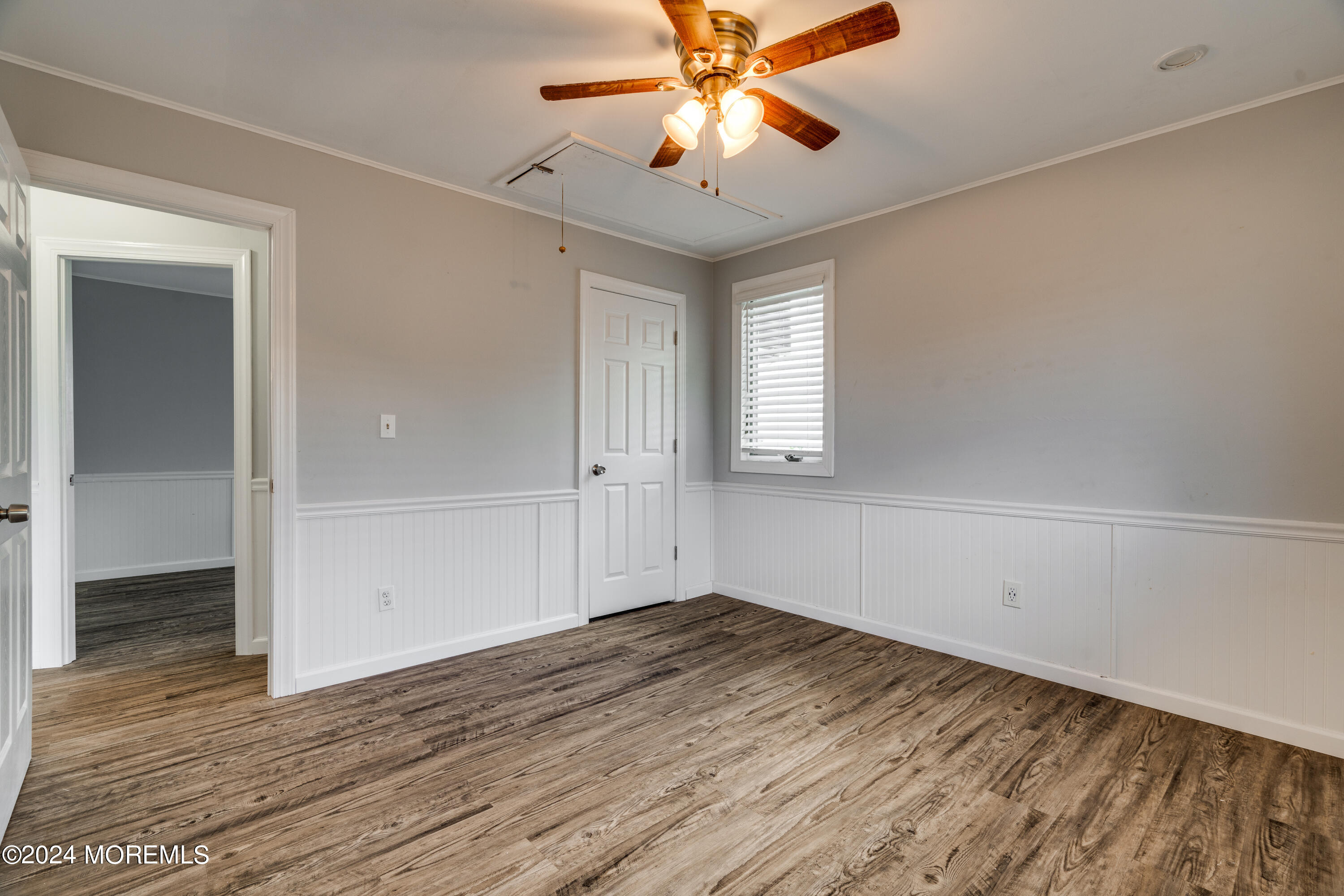 14 Bayview Drive Waretown, NJ 08758 - Photo 19 of 35 a view of empty room with wooden floor and fan