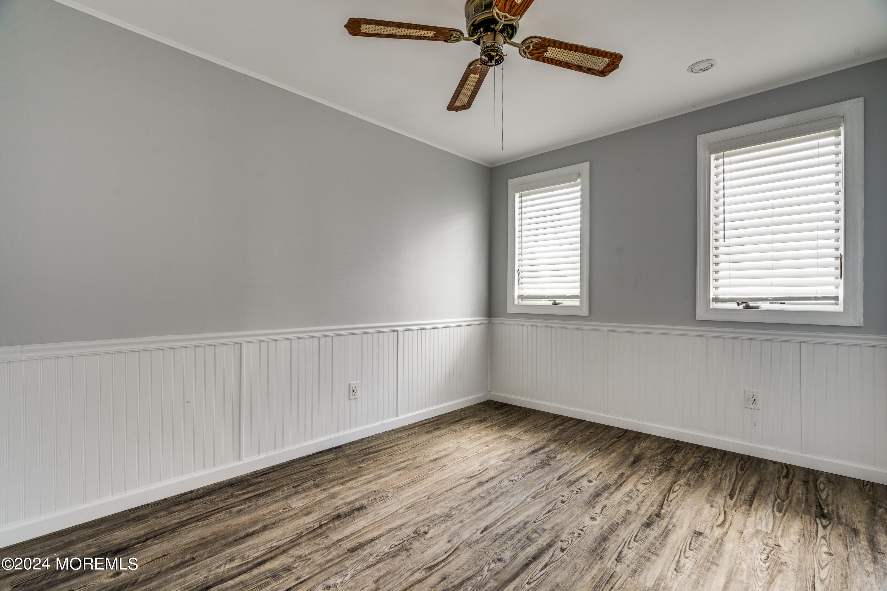14 Bayview Drive Waretown, NJ 08758 - Photo 21 of 35 a view of empty room with wooden floor and fan
