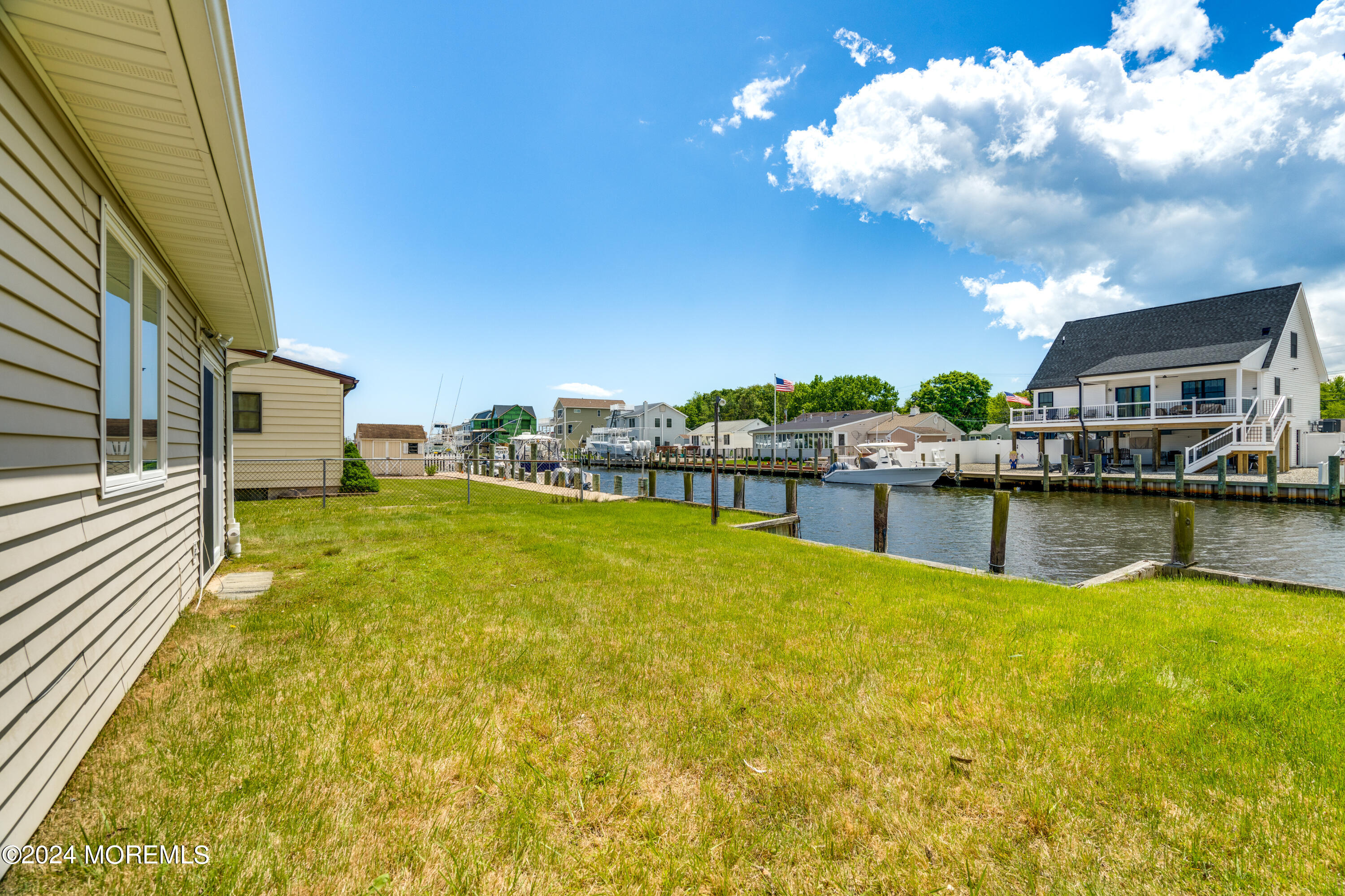 14 Bayview Drive Waretown, NJ 08758 - Photo 6 of 35 a view of a swimming pool with an outdoor seating and a yard
