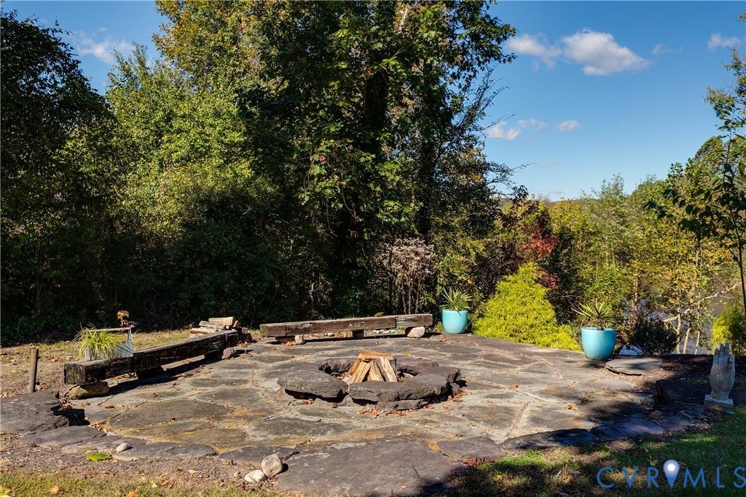 9712 Cherokee Road Richmond, VA 23235 - Photo 46 of 50 Custom firepit with seating overlooking the river.