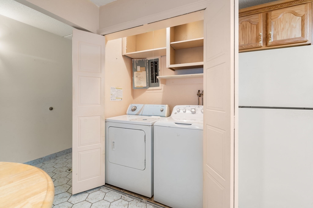 190 High Street, Unit 409 Medford, MA 02155 - Photo 12 of 30 a utility room with dryer and washer