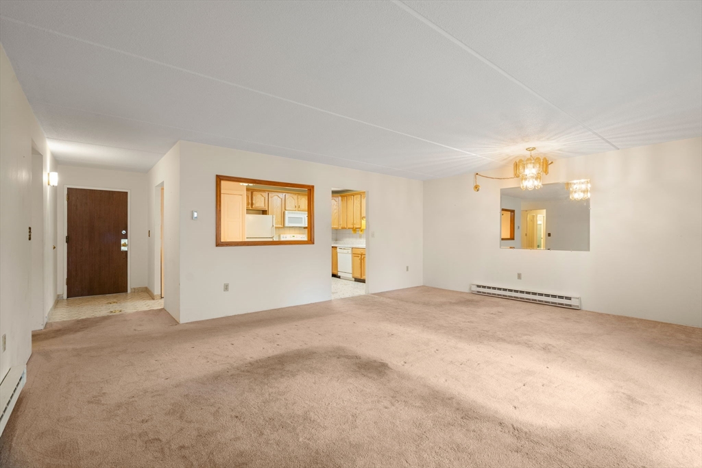 190 High Street, Unit 409 Medford, MA 02155 - Photo 13 of 30 an empty room with windows and closet