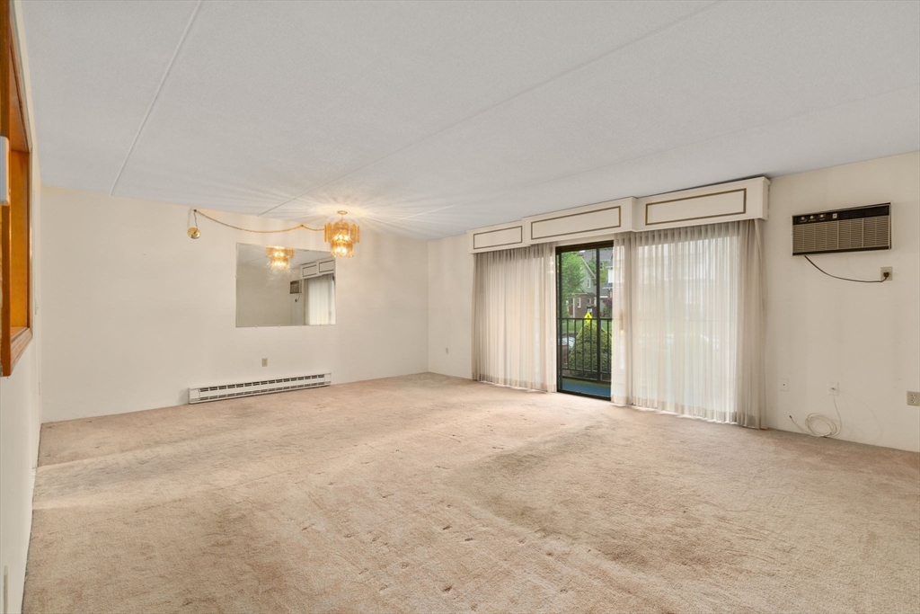 190 High Street, Unit 409 Medford, MA 02155 - Photo 15 of 30 a view of an empty room with a window