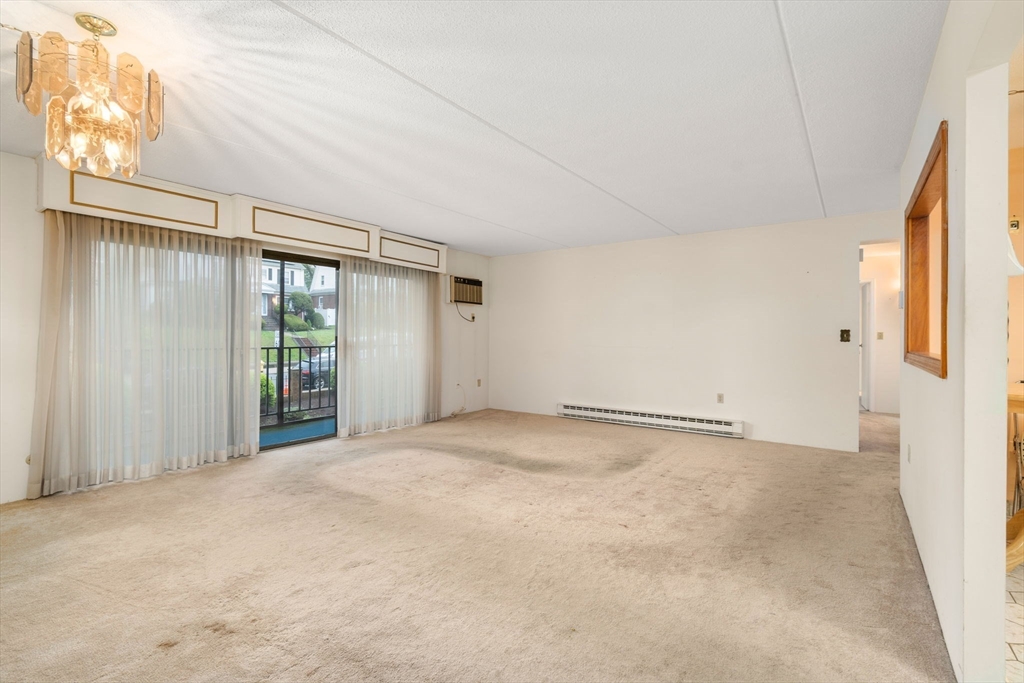 190 High Street, Unit 409 Medford, MA 02155 - Photo 16 of 30 a view of an empty room with a window