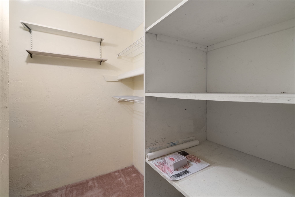 190 High Street, Unit 409 Medford, MA 02155 - Photo 17 of 30 a storage room with cabinets