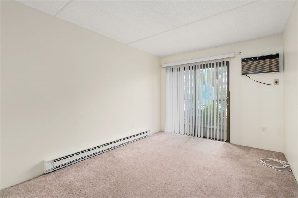 190 High Street, Unit 409 Medford, MA 02155 - Photo 18 of 30 a view of an empty room with a window